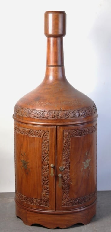 PERSIAN ROSEWOOD INLAID CARVED BOTTLE CELLARETTE: Persian rosewood inlaid carved bottle cellarette. Note: Each lot in this auction was stored in an active industrial warehouse. Accordingly, lots may exhibit dust and/or surface residue and may benefit