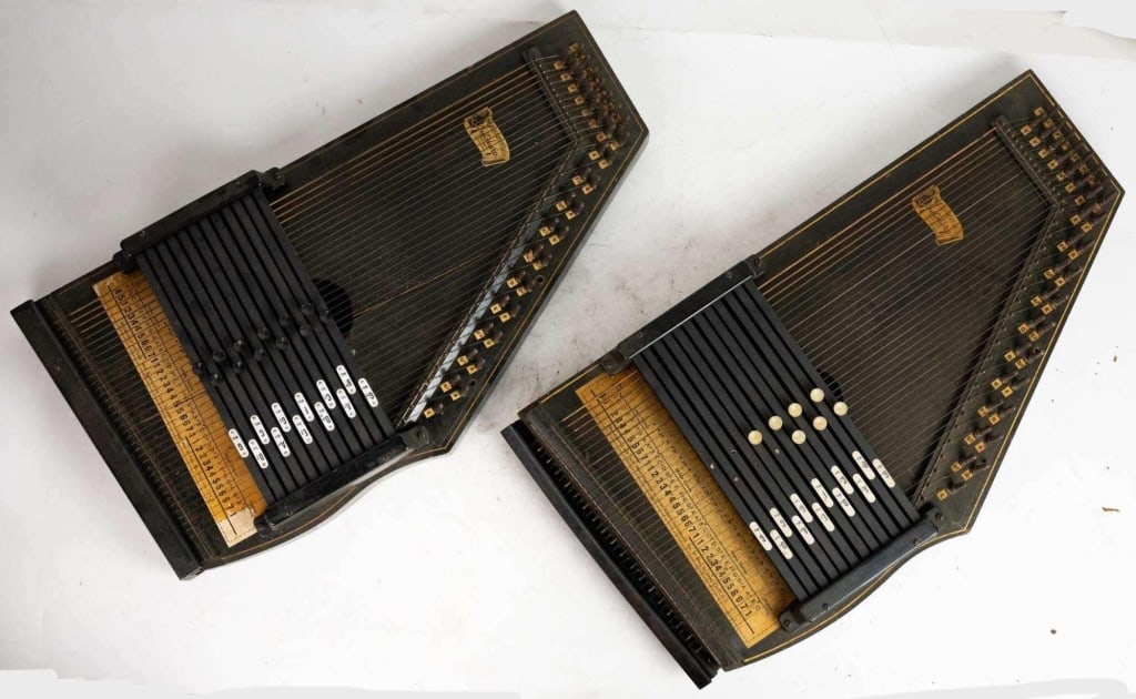 OSCAR SCHMIDT PAIR OF VINTAGE AUTOHARPS: Oscar Schmidt pair of vintage autoharps with original pamphlets. Note: Each lot in this auction was stored in an active industrial warehouse. Accordingly, lots may exhibit dust and/or surface residue 
