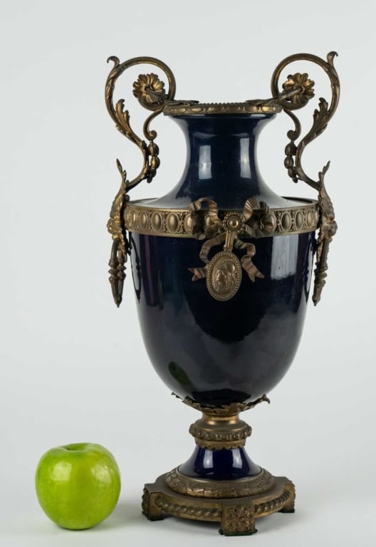 FRENCH BRONZE PATINA MOUNT & PORCELAIN URN: French bronze patina mount & porcelain urn 20th c. Note: Each lot in this auction was stored in an active industrial warehouse. Accordingly, lots may exhibit dust and/or surface residue and may benefi