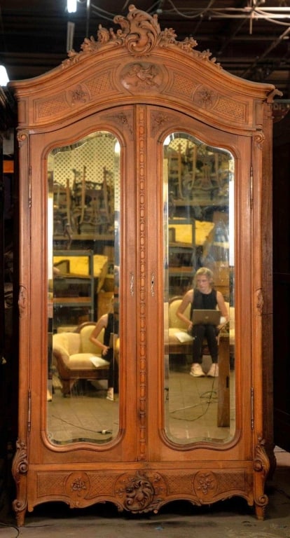 FRENCH ANTIQUE HAND CARVED MIRRORED ARMOIRE: French antique hand carved mirrored armoire. Note: Each lot in this auction was stored in an active industrial warehouse. Accordingly, lots may exhibit dust and/or surface residue and may benefit from