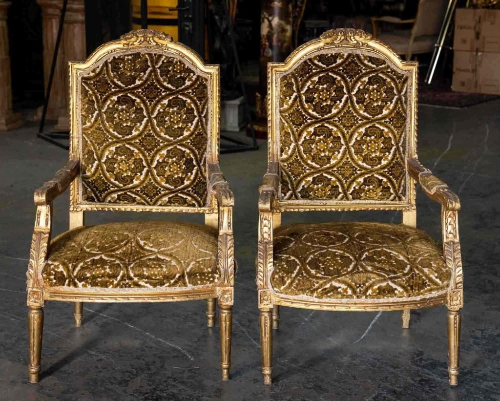 FRENCH PARCEL GILT CUSTOM UPOLSTERED ARMCHAIRS: Pair of French gilt armchairs French, late 19th century. Note: Each lot in this auction was stored in an active industrial warehouse. Accordingly, lots may exhibit dust and/or surface residue and may 