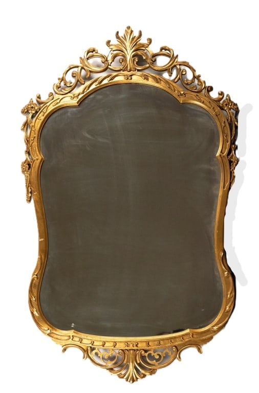 FRENCH CARVED GILT WOOD WALL MIRROR: Carved gilt wood wall mirror. Note: Each lot in this auction was stored in an active industrial warehouse. Accordingly, lots may exhibit dust and/or surface residue and may benefit from cleaning. Appr