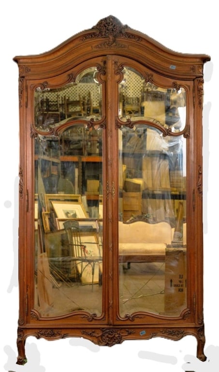 FRENCH ANTIQUE BEVELED MIRRORED ARMOIRE: French antique beveled mirrored armoire. Note: Each lot in this auction was stored in an active industrial warehouse. Accordingly, lots may exhibit dust and/or surface residue and may benefit from cle