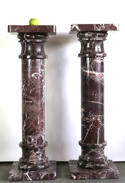 ROUGE MARBLE PEDESTALS: Pair of rouge marble pedestals. Note: Each lot in this auction was stored in an active industrial warehouse. Accordingly, lots may exhibit dust and/or surface residue and may benefit from cleaning. Ap