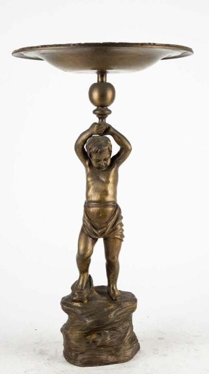 ITALIAN GREEKY BRONZE PATINA PUTTI FORM TAZZA: Italian greeky bronze patina putti form tazza. Note: Each lot in this auction was stored in an active industrial warehouse. Accordingly, lots may exhibit dust and/or surface residue and may benefit fr