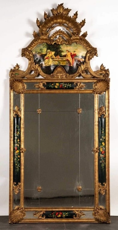 ITALIAN GILT MAHOGANY MIRROR W/ PAINTED SCENE: Hard carved gilt mahogany mirror w/ painted scene. Note: Each lot in this auction was stored in an active industrial warehouse. Accordingly, lots may exhibit dust and/or surface residue and may benefi
