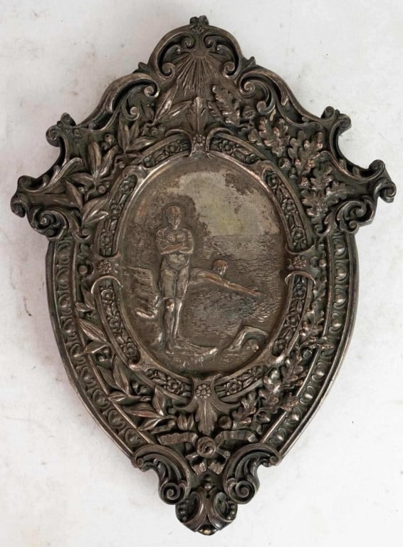 FRENCH BAROQUE STYLE SILVERED WALL PLAQUE: French art nouveau style silvered wall plaque possibly Olympic themed. Note: Each lot in this auction was stored in an active industrial warehouse. Accordingly, lots may exhibit dust and/or surface re