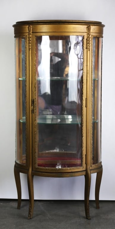 FRENCH GILT VITRINE: Some damage to the front. One of the interior shelves is chipped. Note: Each lot in this auction was stored in an active industrial warehouse. Accordingly, lots may exhibit dust and/or surface residue