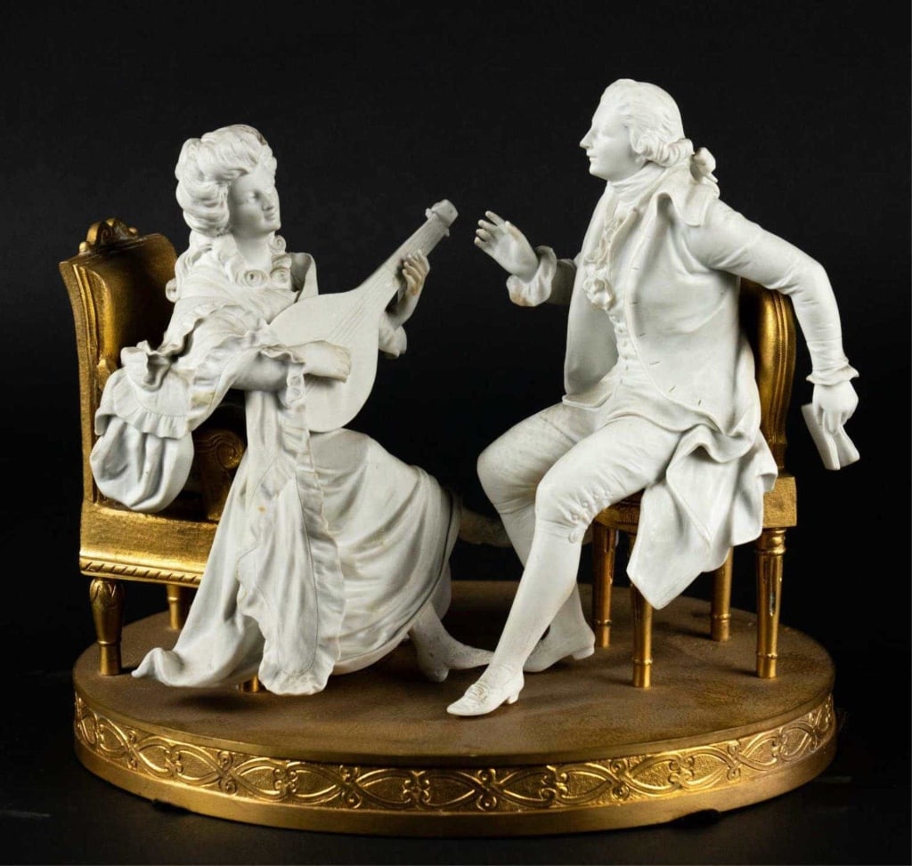 FRENCH SERVES STYLE BRONZE & BISQUE SCULPTURE: French serves style bronze & bisque sculpture. Note: Each lot in this auction was stored in an active industrial warehouse. Accordingly, lots may exhibit dust and/or surface residue and may benefit fr