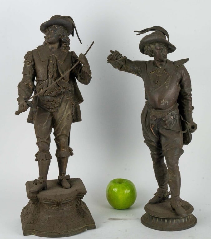 ANTIQUE SPELTER CONQUISTADOR STATUES: Pair of antique spelter conquistador statues. Note: Each lot in this auction was stored in an active industrial warehouse. Accordingly, lots may exhibit dust and/or surface residue and may benefit fro