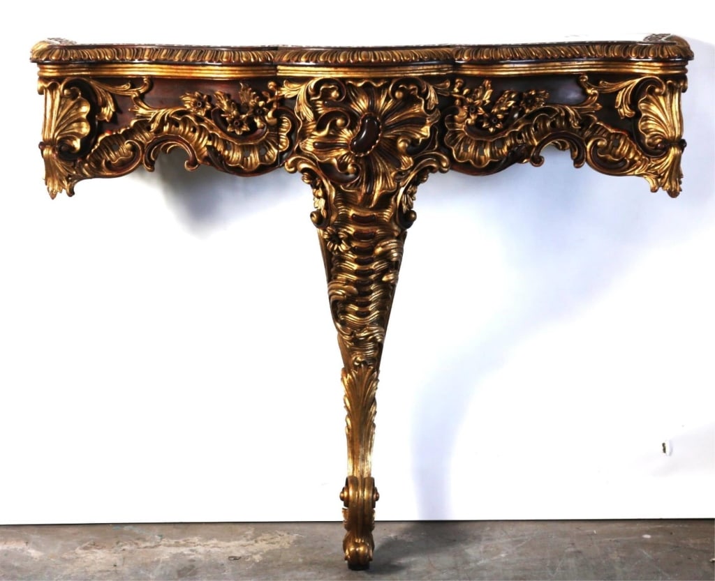 ITALIAN PARCEL GILT MAHOGANY CARVED CONSOLE: Single Italian parcel Gilt figural Mahogany carved console. Note: Each lot in this auction was stored in an active industrial warehouse. Accordingly, lots may exhibit dust and/or surface residue and m