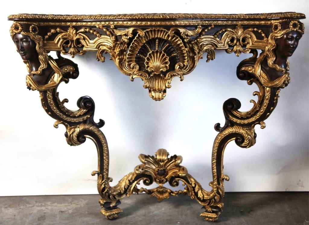 ITALIAN PARCEL GILT MAHOGANY CARVED CONSOLE: Italian parcel Gilt figural Mahogany carved console. Note: Each lot in this auction was stored in an active industrial warehouse. Accordingly, lots may exhibit dust and/or surface residue and may bene