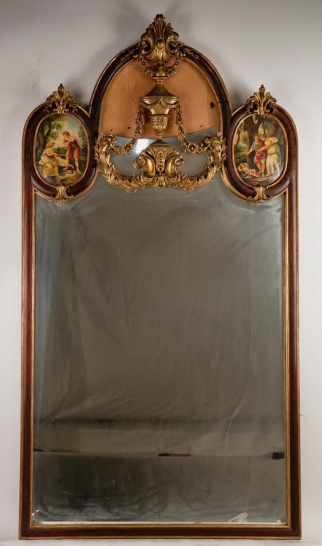 ORNATE CARVED MAHOGANY MIRROR WITH PAINTED SCENES: Ornate carved mahogany wood mirror with painted scenes. Note: Each lot in this auction was stored in an active industrial warehouse. Accordingly, lots may exhibit dust and/or surface residue and may b