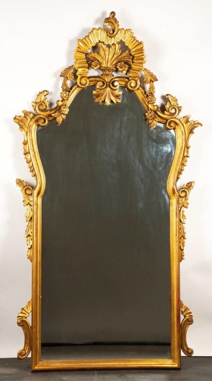 ITALIAN ORNATE CARVED GILT WOOD MIRROR: Italian ornate carved Gilt wood mirror. Note: Each lot in this auction was stored in an active industrial warehouse. Accordingly, lots may exhibit dust and/or surface residue and may benefit from clea