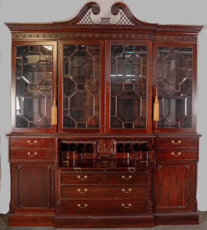 ENGLISH STYLE MONUMENTAL MAHOGANY BREAKFRONT SECRETAIRE: Fine English style monumental Mahogany breakfront secretaire bookcase. Note: Each lot in this auction was stored in an active industrial warehouse. Accordingly, lots may exhibit dust and/or surface re