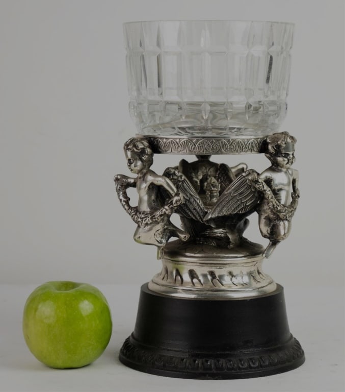 FRENCH SILVER CHERUB CUT GLASS CELERY CASTOR BOWL: Cut glass celery castor style bowl on metal stand with putti. Note: Each lot in this auction was stored in an active industrial warehouse. Accordingly, lots may exhibit dust and/or surface residue and