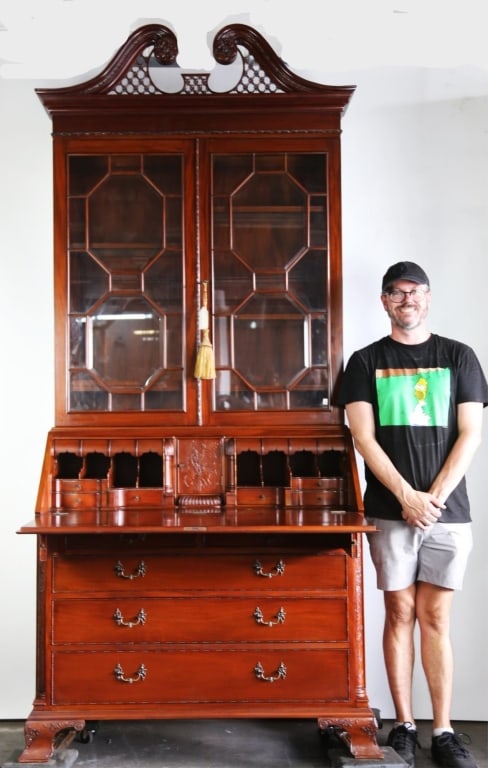 ENGLISH STYLE MAHOGANY SLENDER-FRONT BUREAU CABINET: English style Mahogany slender-front bureau cabinet. Note: Each lot in this auction was stored in an active industrial warehouse. Accordingly, lots may exhibit dust and/or surface residue and may bene