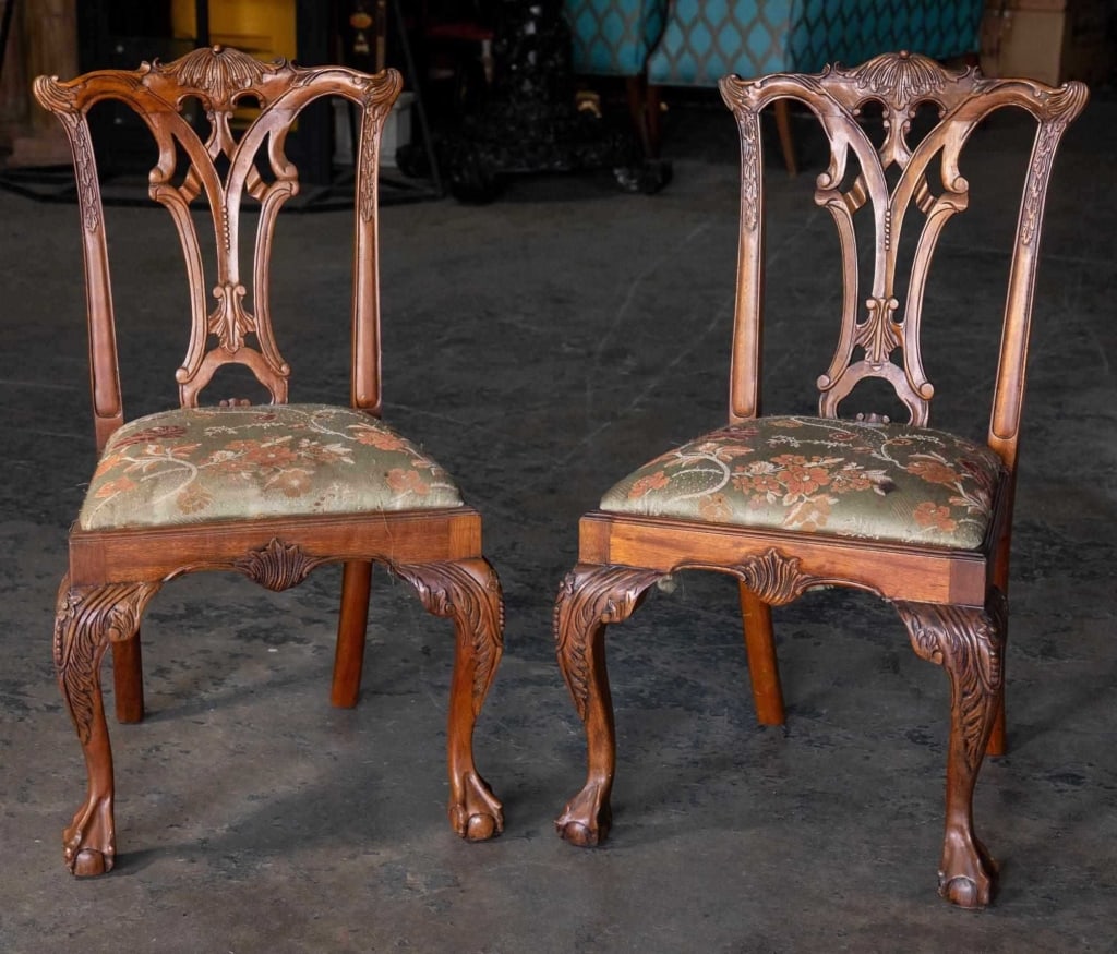 ENGLISH CHIPPENDALE HAND-CARVED MAHOGANY CHAIRS: Pair of Chippendale hand-carved Mahogany side chairs. Note: Each lot in this auction was stored in an active industrial warehouse. Accordingly, lots may exhibit dust and/or surface residue and may ben