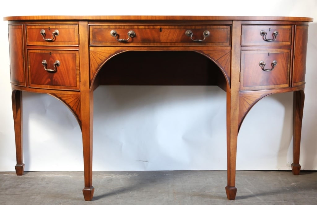 ENGLISH BANDED FAN-INLAY BOW FRONT SIDEBOARD: English banded fan-inlay bow front sideboard. Note: Each lot in this auction was stored in an active industrial warehouse. Accordingly, lots may exhibit dust and/or surface residue and may benefit fro