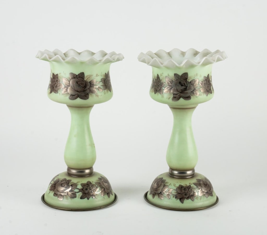 ANTIQUE VICTORIAN ANTIQUE HURRICANES GLASS VASES: Hand-painted celadon covered milk glass, sterling overlay. Note: Each lot in this auction was stored in an active industrial warehouse. Accordingly, lots may exhibit dust and/or surface residue and ma