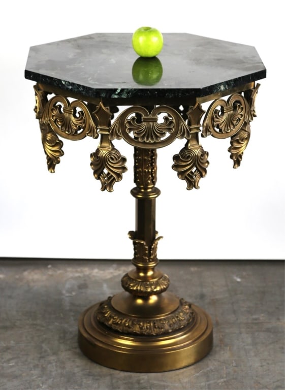EUROPEAN BRASS MARBLE TOP CENTER TABLE: European brass marble top center table. Note: Each lot in this auction was stored in an active industrial warehouse. Accordingly, lots may exhibit dust and/or surface residue and may benefit from clea