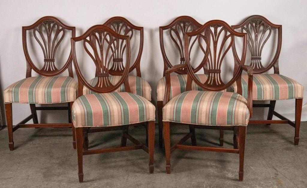 AMERICAN SET OF 6 HEPPLEWHITE STYLE CARVED CHAIRS: American set of 6 Hepplewhite style carved chairs one with arms. Note: Each lot in this auction was stored in an active industrial warehouse. Accordingly, lots may exhibit dust and/or surface residue