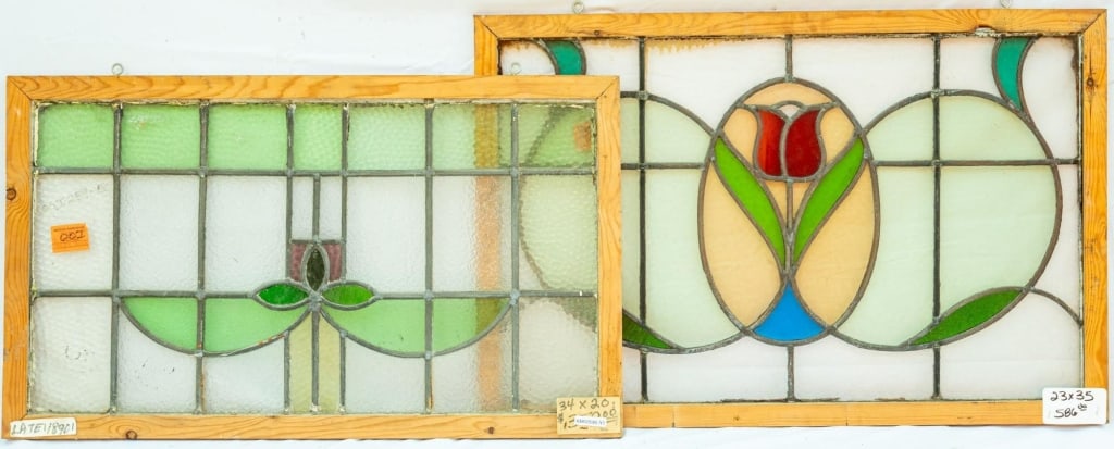 TWO FRENCH ART NOUVEAU STAINED GLASS PANELS: Two French Art Nouveau stained glass panels with a floral motif. Approximate dimensions: h. 23", w. 35" Disclaimer: This is an online court ordered bankruptcy sale. Participating bidders must have a c