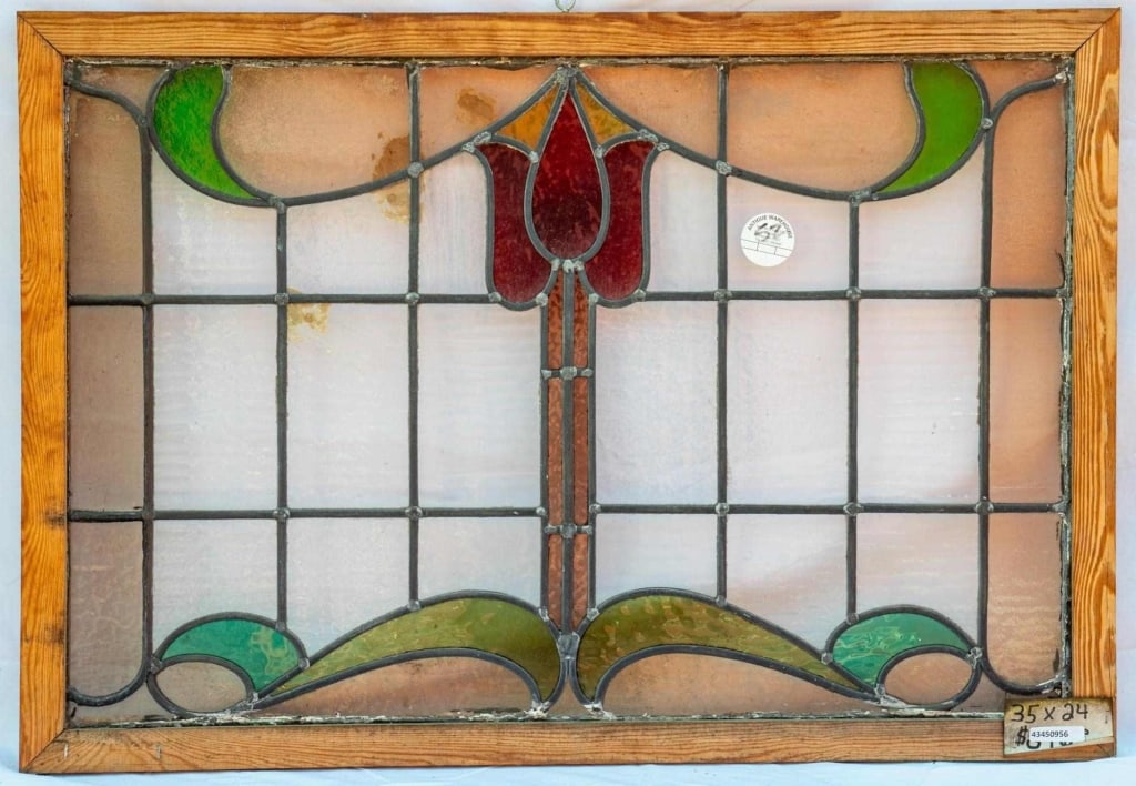 FRENCH ART NOUVEAU STAINED GLASS PANEL: French Art Nouveau stained glass panel with a red floral medallion accented with pink and green stained glass. Approximate dimensions: h. 24", w. 35" Disclaimer: This is an online court ordered bankru