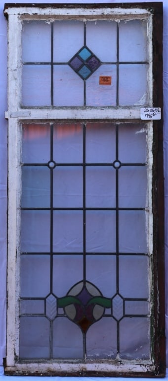ANTIQUE STAINED GLASS WINDOW: Antique jeweled stained glass window. Approximate dimensions: h. 26", h. 61.5" Disclaimer: This is an online court ordered bankruptcy sale. Participating bidders must have a credit card on file with L