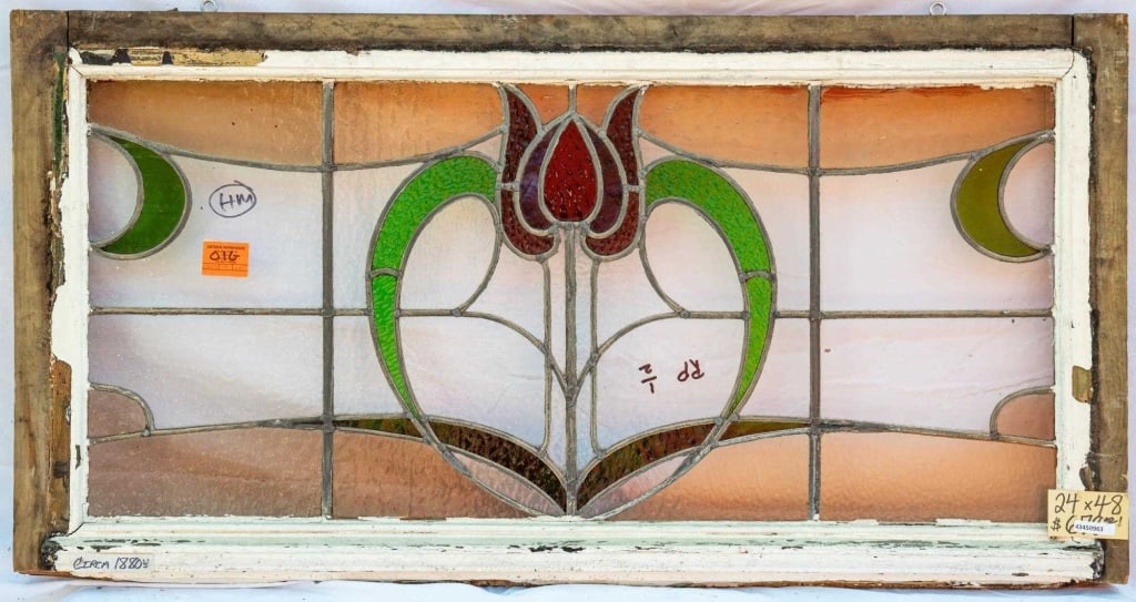FRENCH ART NOUVEAU STAINED GLASS PANEL: French Art Nouveau stained glass panel with a red floral medallion. Approximate dimensions: h. 24", w. 48" Disclaimer: This is an online court ordered bankruptcy sale. Participating bidders must have