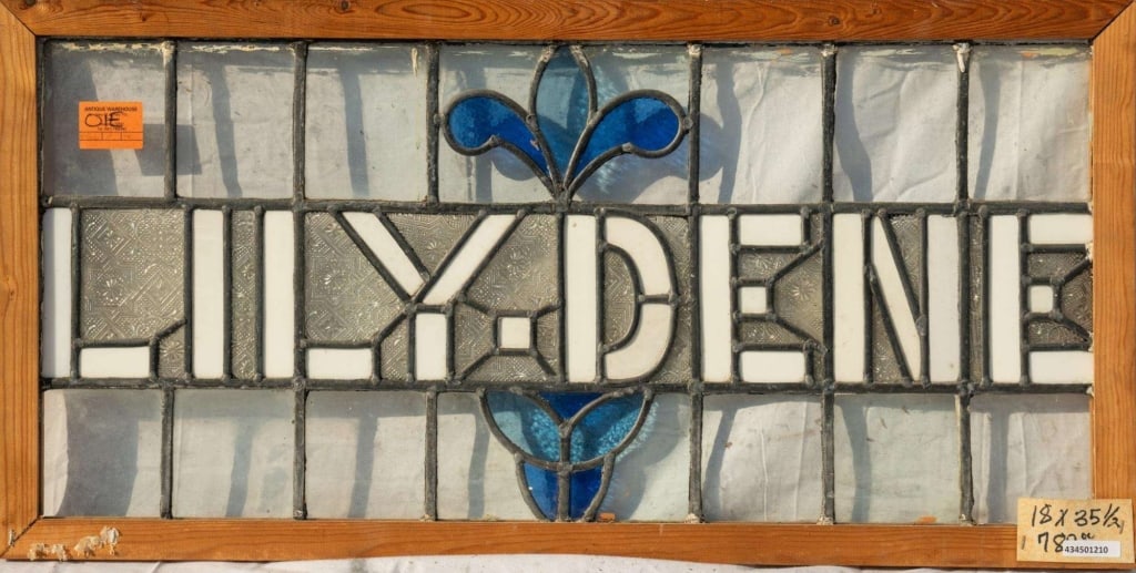 ENGLISH 'LILYDENE' STAINED GLASS PANEL: English 'Lilydene' stained glass panel. Approximate dimensions: h. 18", w. 35.5" Disclaimer: This is an online court ordered bankruptcy sale. Participating bidders must have a credit card on file with