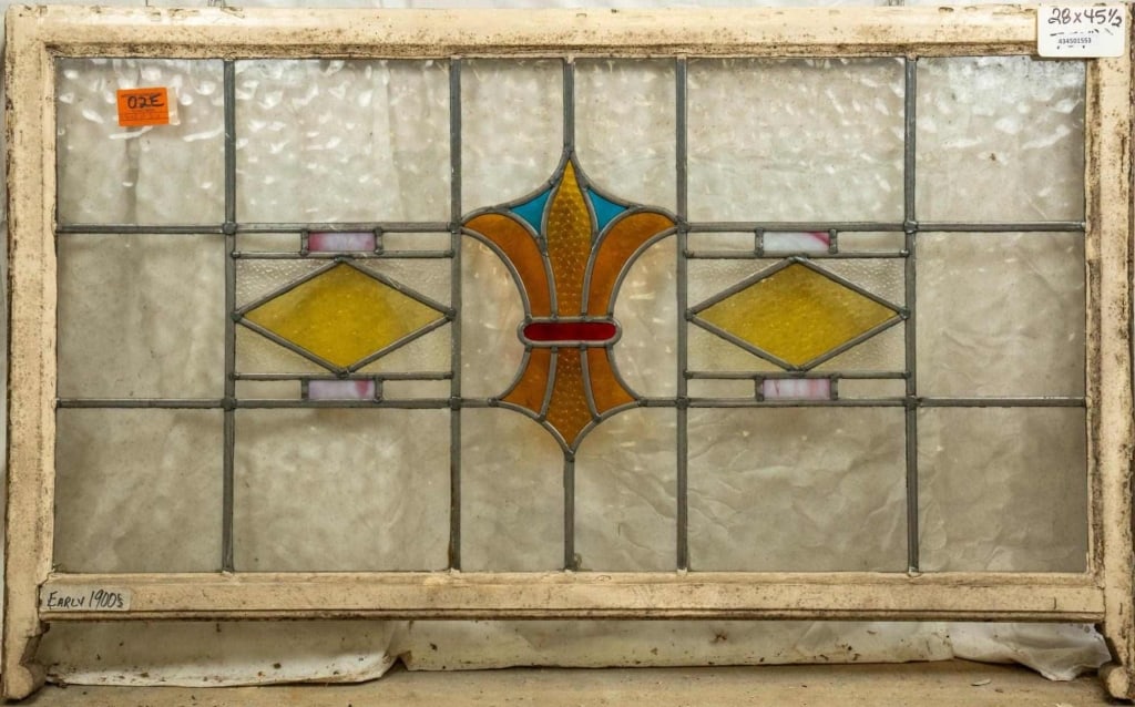 ENGLISH ART NOUVEAU STAINED GLASS PANEL: English Art Nouveau stained glass panel with wispy glass accents. Approximate dimensions: h. 28", w. 45.5" Disclaimer: This is an online court ordered bankruptcy sale. Participating bidders must have