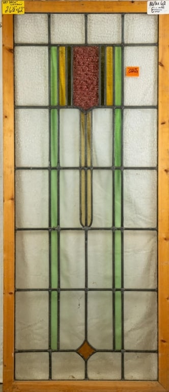 ENGLISH ART DECO STAINED GLASS PANEL: English Art Deco stained glass panel with geometrical multicolored accents. Approximate dimensions: h. 62", w. 26.5" Disclaimer: This is an online court ordered bankruptcy sale. Participating bidders