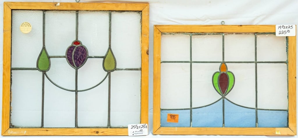 TWO FRENCH STAINED GLASS PANELS: Two French stained glass panels with floral motif stained glass accents and colorless leaded glass panels. Approximate dimensions: h. 25.5", w. 23.5" Disclaimer: This is an online court ordered bankru