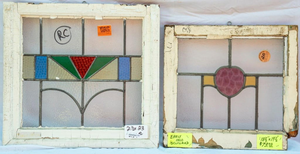 TWO CONTINENTAL LEADED STAINED GLASS PANELS: Two Continental leaded stained glass panels with floral and geometric motifs. Approximate dimensions: h. 23", w. 21.5" Disclaimer: This is an online court ordered bankruptcy sale. Participating bidder