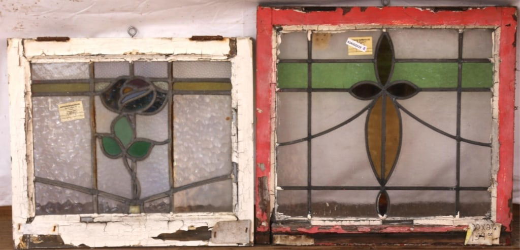 TWO ANTIQUE CONTINENTAL STAINED GLASS PANELS: Two antique Continental stained glass panels, one with a rose medallion, the other with a multicolored floral motif medallion. Approximate dimensions: h. 20", w. 25" Disclaimer: This is an online cour