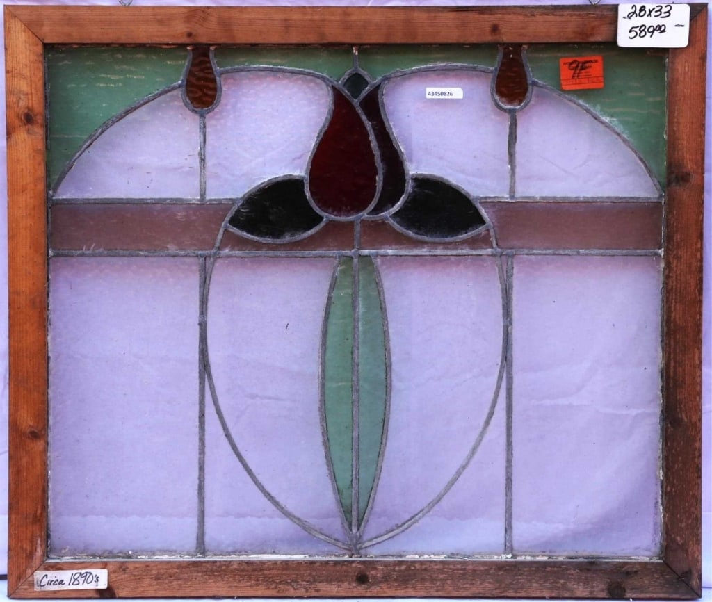 ANTIQUE STAINED GLASS WINDOW: Antique stained glass window. Approximate dimensions: h. 28", w. 33" Disclaimer: This is an online court ordered bankruptcy sale. Participating bidders must have a credit card on file with Live Auctio