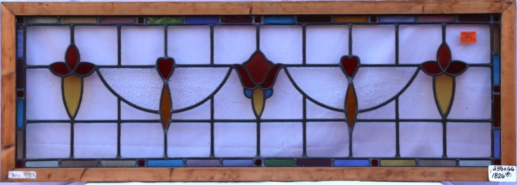 ANTIQUE STAINED GLASS WINDOW: Antique stained glass window. Approximate dimensions: h. 23.5, w. 66' Disclaimer: This is an online court ordered bankruptcy sale. Participating bidders must have a credit card on file with Live Aucti