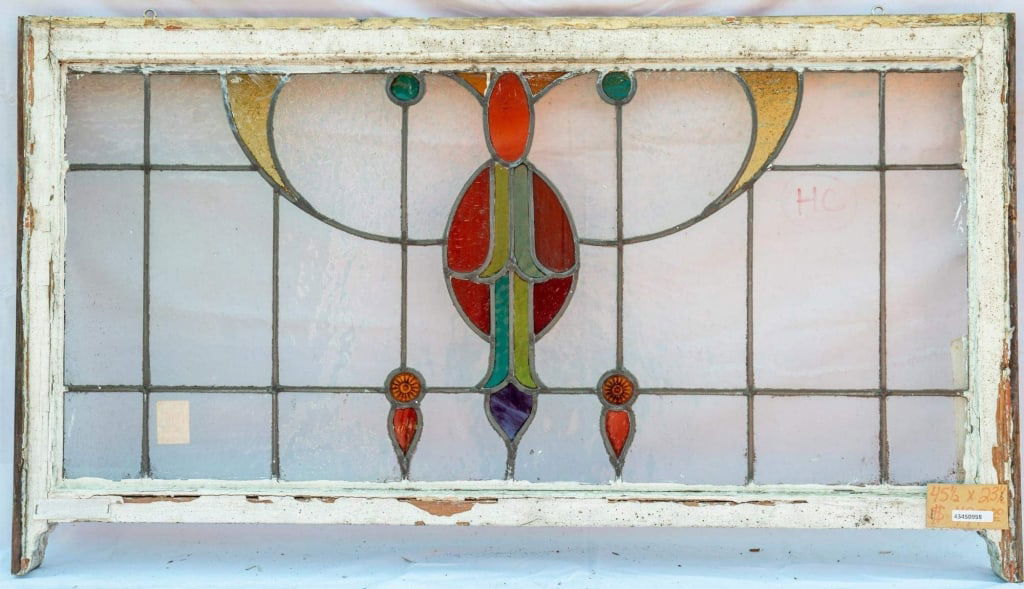 CONTINENTAL STAINED GLASS PANEL: Continental stained glass panel with leaded stained glass panels. Approximate dimensions: h. 23.5, w. 45.5" Disclaimer: This is an online court ordered bankruptcy sale. Participating bidders must have