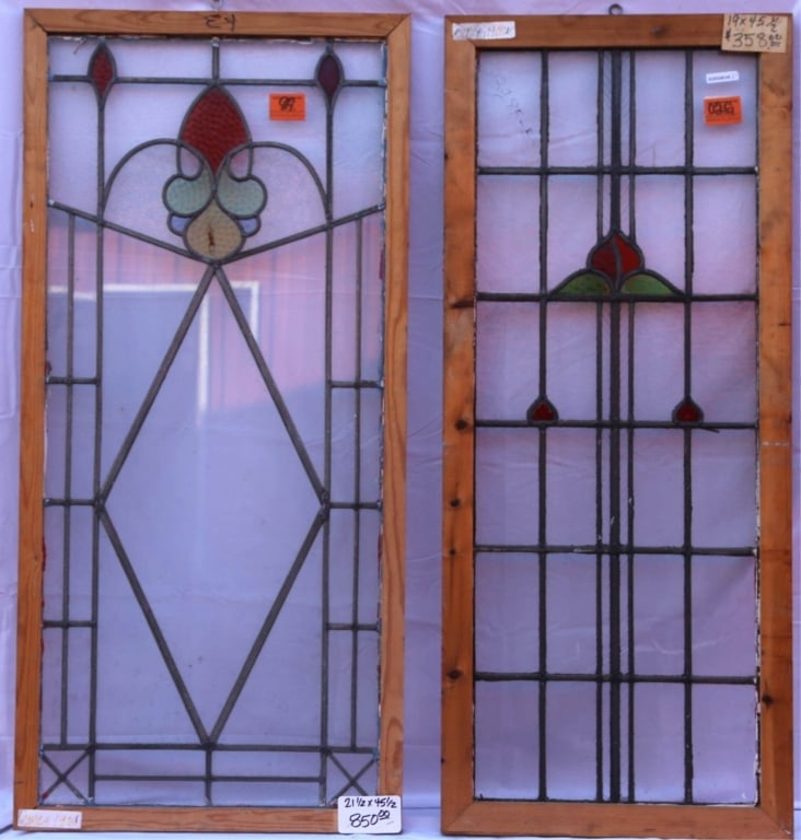 TWO ANTIQUE STAINED GLASS WINDOWS: Two antique stained glass windows. Approximate dimensions: h. 21.5", w. 45.5" Disclaimer: This is an online court ordered bankruptcy sale. Participating bidders must have a credit card on file with Li