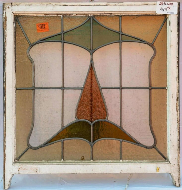FRENCH ART DECO STAINED GLASS PANEL: French Art Deco stained glass panel with red, green, and amber stained glass, and leaded colorless glass panels. Approximate dimensions: h. 29", w. 28.5" Disclaimer: This is an online court ordered ba