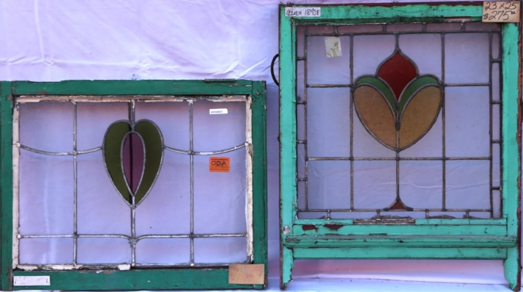 TWO ANTIQUE STAINED GLASS WINDOWS: Two antique stained glass windows in green wood frame. Approximate dimensions: h. 23", w. 25" Disclaimer: This is an online court ordered bankruptcy sale. Participating bidders must have a credit card