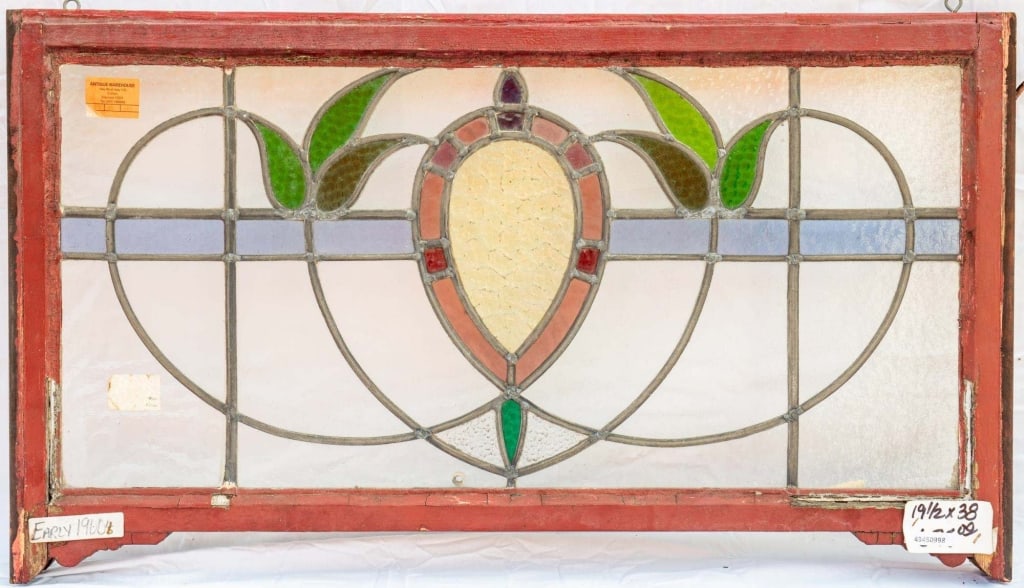 FRENCH ART NOUVEAU STAINED GLASS PANEL: French Art Nouveau stained glass panel with a floral and leaf motif. Approximate dimensions: h. 19.5", w. 38" Disclaimer: This is an online court ordered bankruptcy sale. Participating bidders must ha