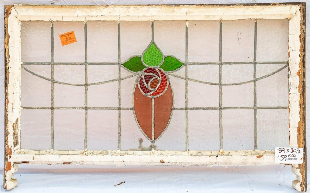 FRENCH ART NOUVEAU STAINED GLASS PANEL: French Art Nouveau stained glass panel with floral and leaf motif details. Approximate dimensions: h. 20.5", w. 39" Disclaimer: This is an online court ordered bankruptcy sale. Participating bidders m