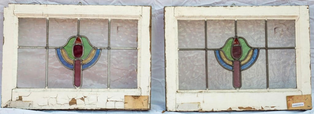 PAIR OF FRENCH ART NOUVEAU STAINED GLASS PANELS: Pair of French Art Nouveau stained glass panels composed of abstract stained glass elements in blue, yellow, green, and red. Approximate dimensions: h. 15", w. 21" Disclaimer: This is an online court