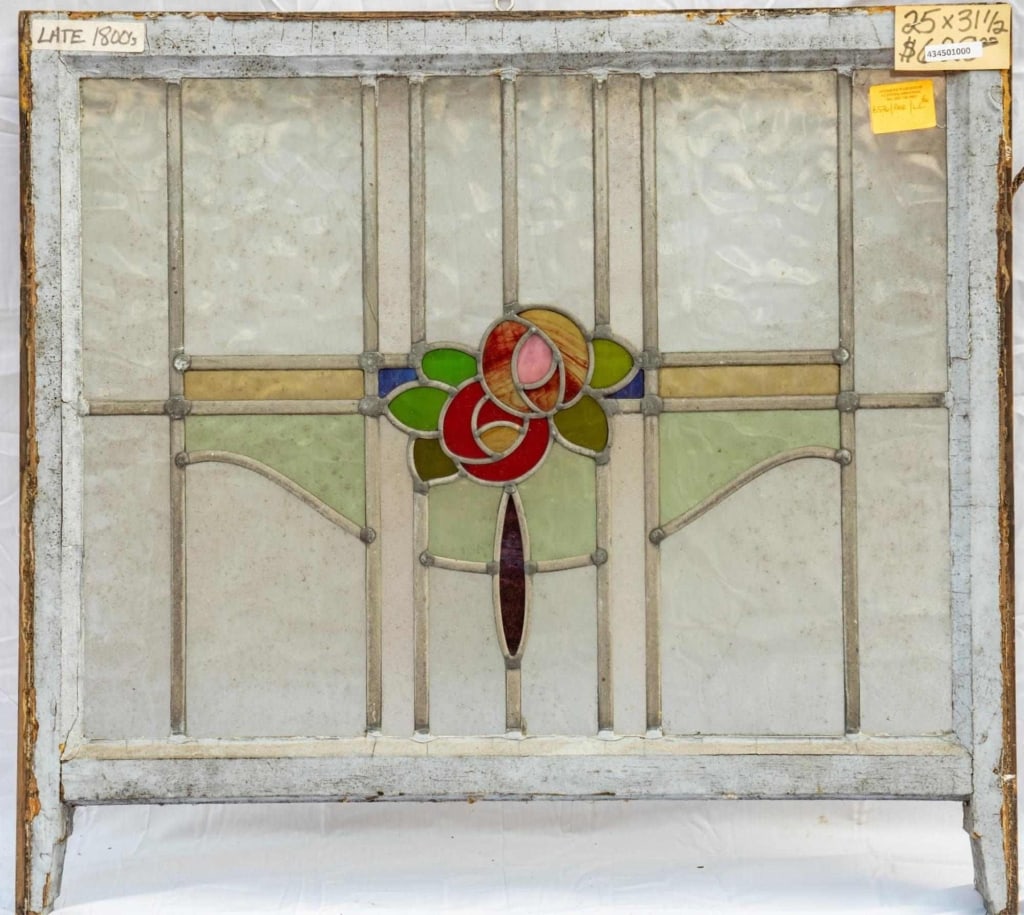 FRENCH ART NOUVEAU STAINED GLASS PANEL: French Art Nouveau stained glass panel composed of floral stained glass insets within colorless leaded glass panels. Approximate dimensions: h. 25", w. 31.5" Disclaimer: This is an online court ordere