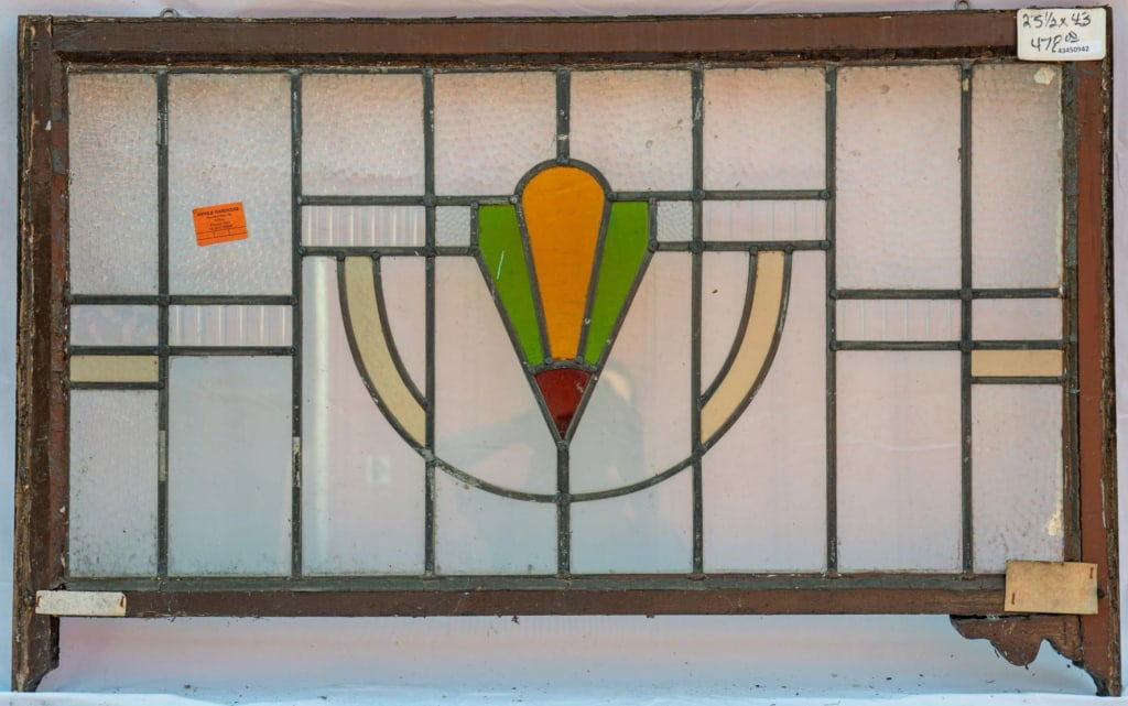 FRENCH ART NOUVEAU STAINED GLASS PANEL: French Art Nouveau stained glass panel with a floral motif set within colorless textured leaded glass panels. Approximate dimensions: h. 25.5", w. 43" Disclaimer: This is an online court ordered bankr