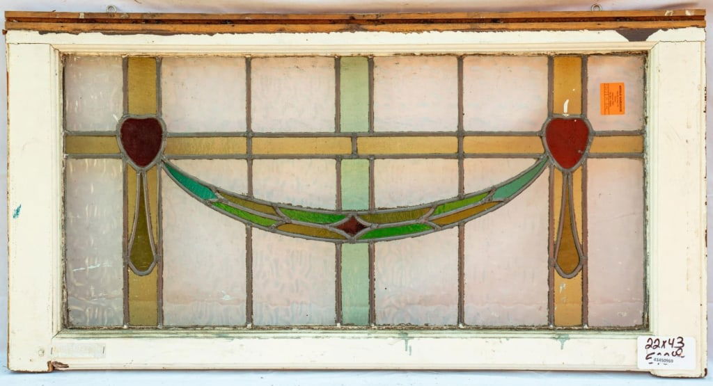 FRENCH ART NOUVEAU STAINED GLASS PANEL: French Art Nouveau stained glass panel with a floral and ribbon motif. Approximate dimensions: h. 22", w. 43" Disclaimer: This is an online court ordered bankruptcy sale. Participating bidders must ha