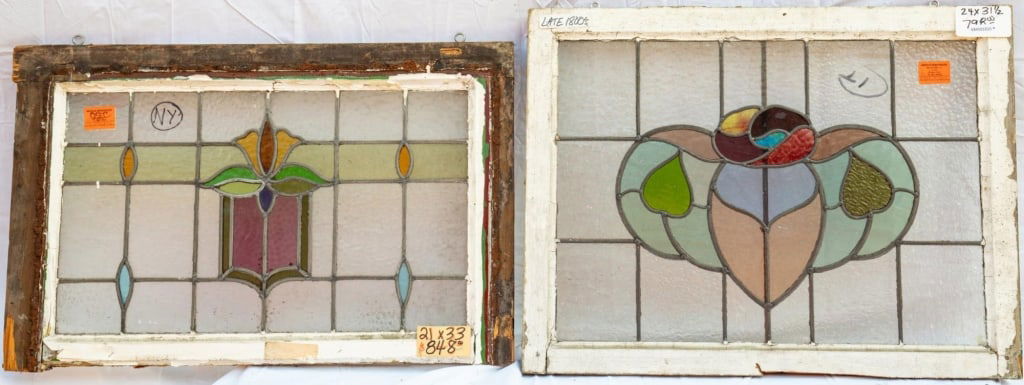 TWO FRENCH ART NOUVEAU STAINED GLASS PANELS: Two French Art Nouveau stained glass panels with a floral medallion and multicolored leaded stained glass panels. Approximate dimensions: h. 24", w. 31.5" Disclaimer: This is an online court ordered b
