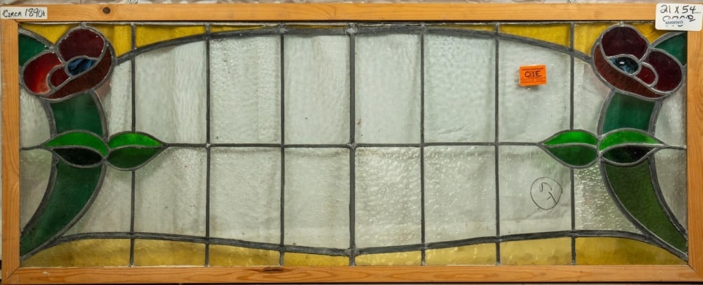 FRENCH ART NOUVEAU STAINED GLASS PANEL: French Art Nouveau stained glass panel with symmetrical red poppy flowers and leaf details on each side of the panel. Approximate dimensions: h. 21", w. 54" Disclaimer: This is an online court ordered